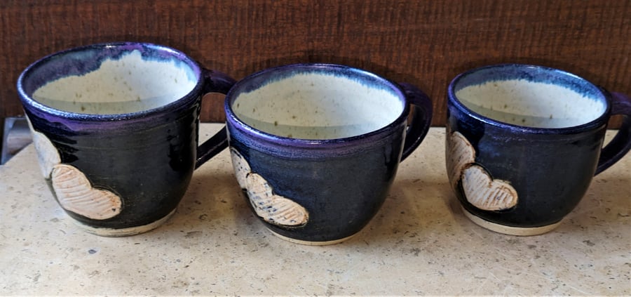 Gorgeous heart decorated blue stoneware mugs with teapot