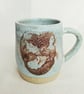 A handmade Mermaid mug, stoneware cup, turquoise glaze
