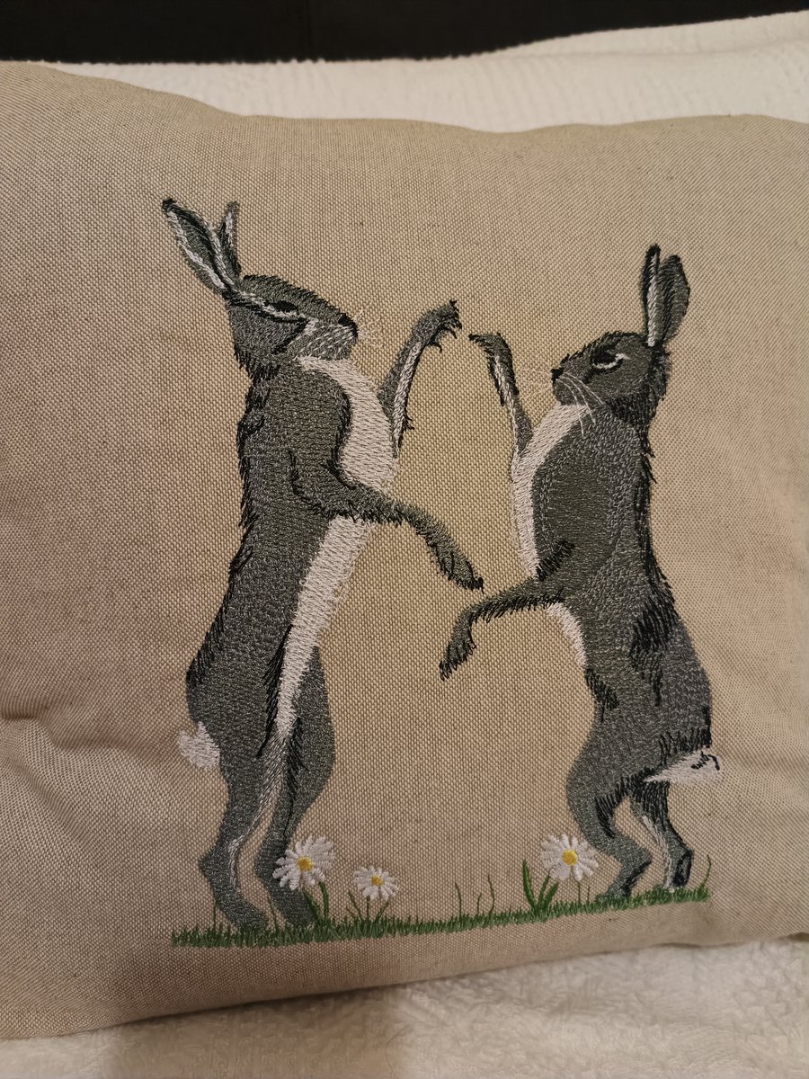 Boxing hares cushion cover