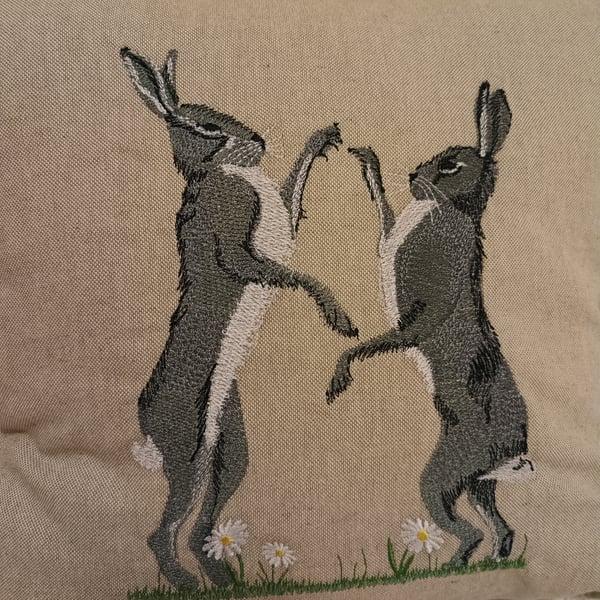 Boxing hares cushion cover