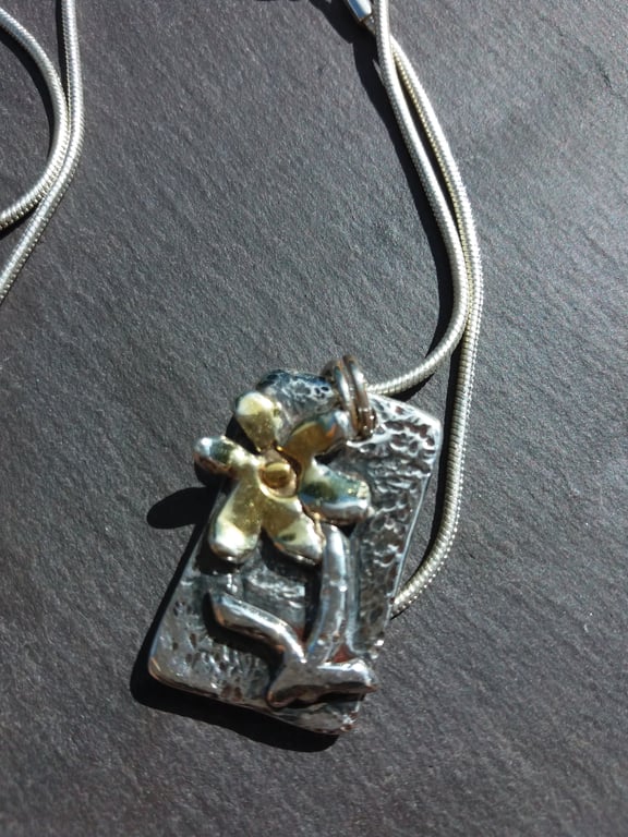 Silver flower pendant