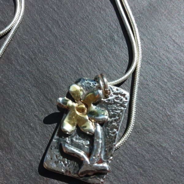 Silver flower pendant