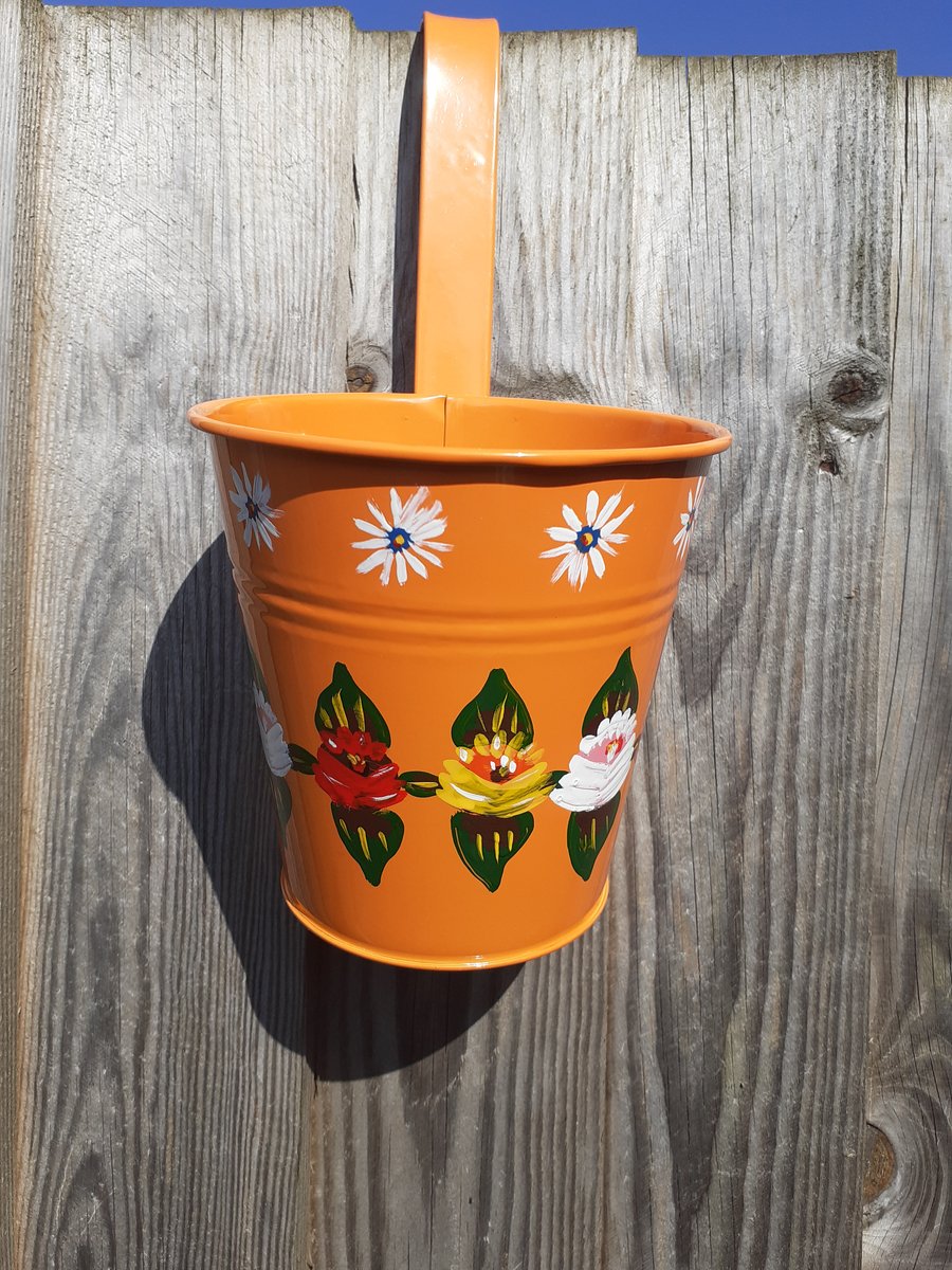 Round hanging planter handpainted with canal art style roses and daisies