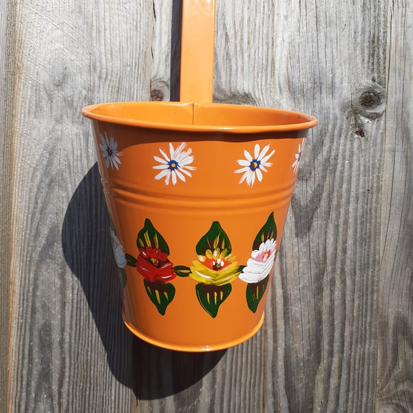 Round hanging planter handpainted with canal art style roses and daisies