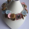 Wooden effect, pale pink and blue button bracelet