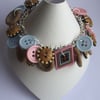 Wooden effect, pale pink and blue button bracelet