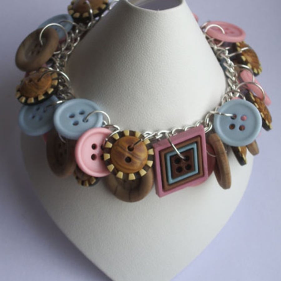 Wooden effect, pale pink and blue button bracelet