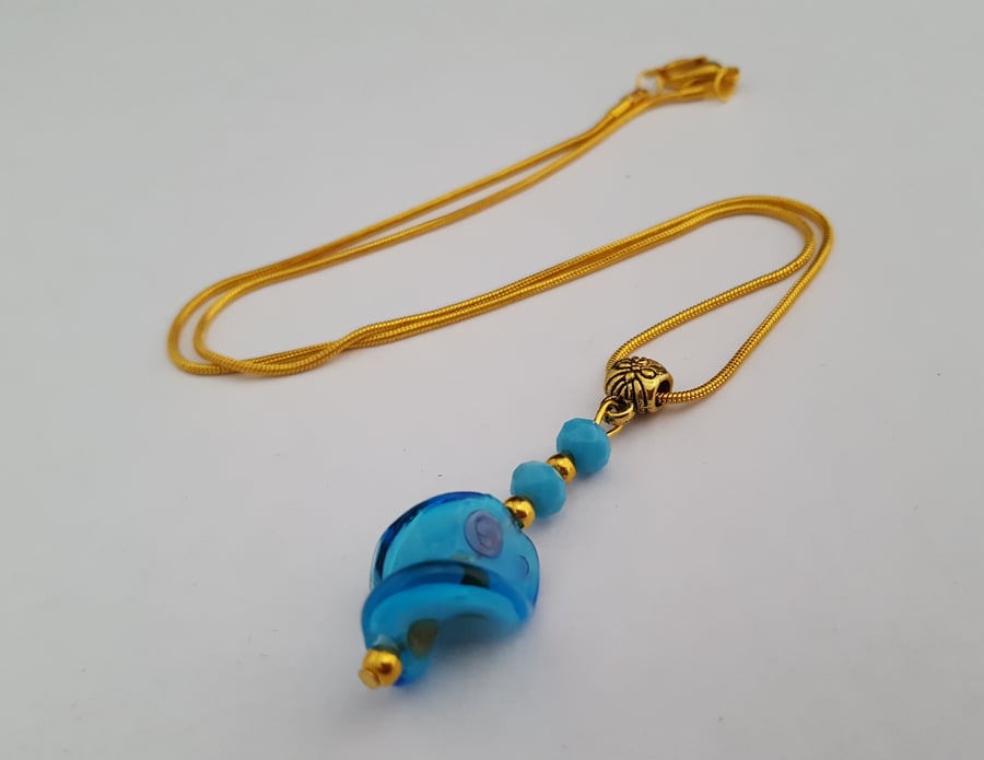 Turquoise lampwork twist pendant on gold plated snake chain