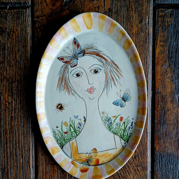 Figurative shallow wall plaque 