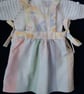 Reversible baby dress in pastel colours including a Laura Ashley print - Image 1
