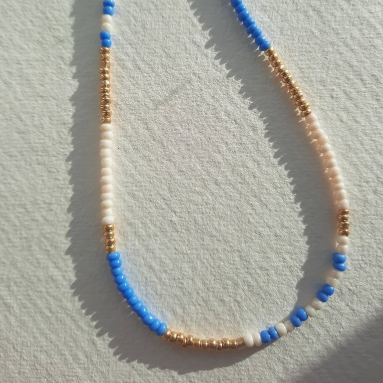 Glass beaded necklace, cornflower blue, cream, gold, 19 to 21 inches