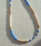 Glass beaded necklace, cornflower blue, cream, gold, 19 to 21 inches