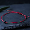 Women's red string bracelet with tourmaline 