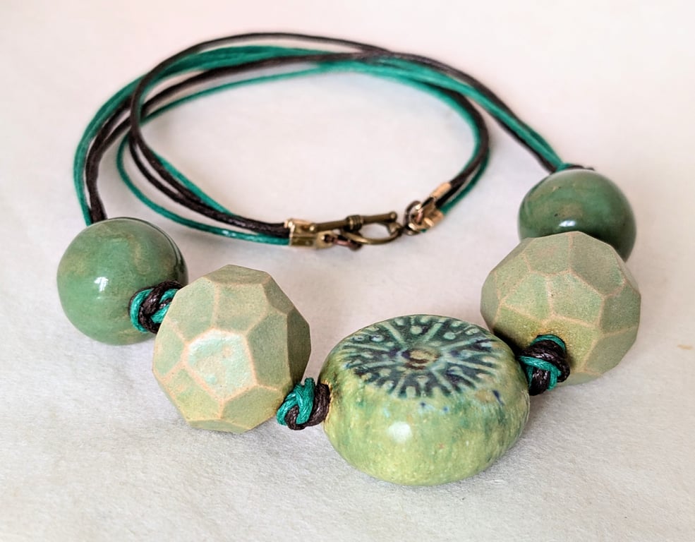 Chunky green ceramic necklace on knotted cord