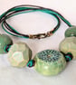 Chunky green ceramic necklace on knotted cord