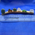 Frosted sea glass 'nuggets' on driftwood.