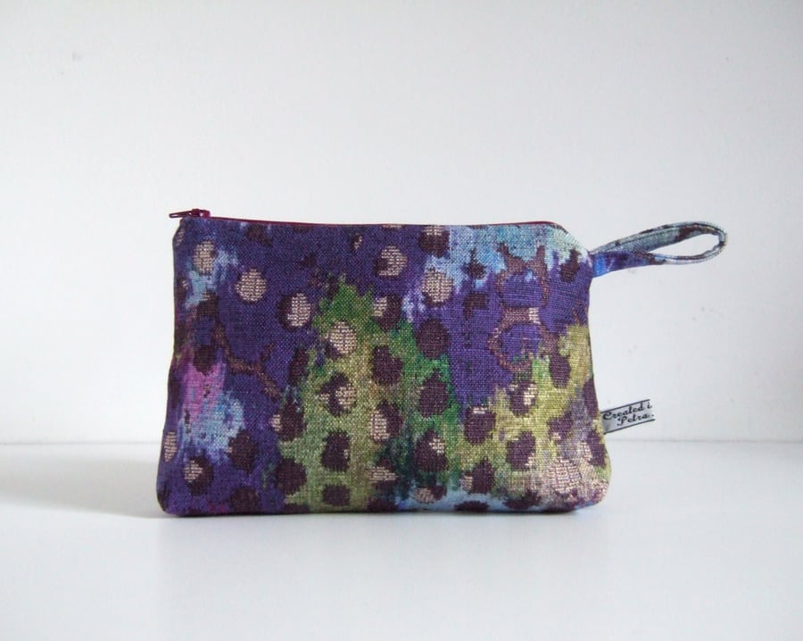 Toiletries or make up bag in dramatic abstract print.