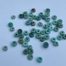 2.5g Chinese turquoise disc drilled beads