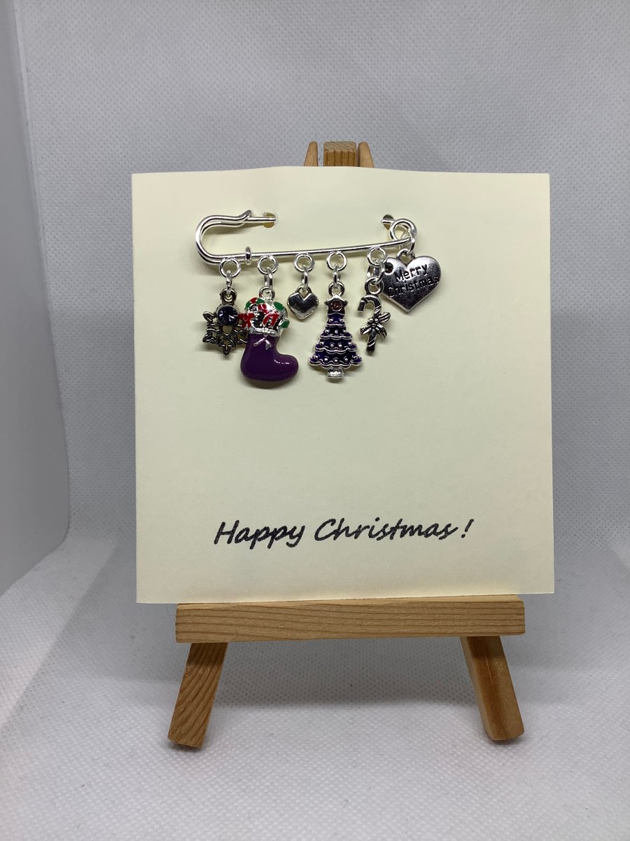 Handmade Christmas Kilt pin brooch, attached to a hand stamped greetings card ()