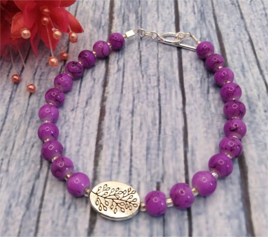 Leaf motif purple glass bracelet
