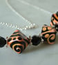 BLACK AND PEACH LAMPWORK NECKLACE - - FREE SHIPPING WORLDWIDE - Image 1
