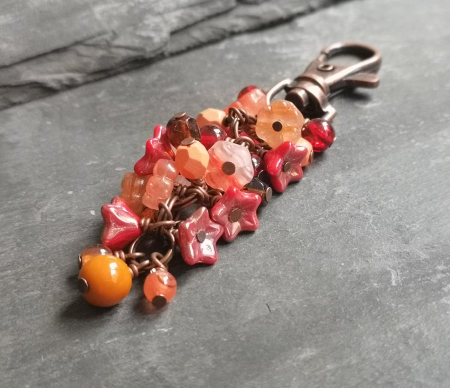 Copper bag charm with peach, orange and red Czech glass beads 
