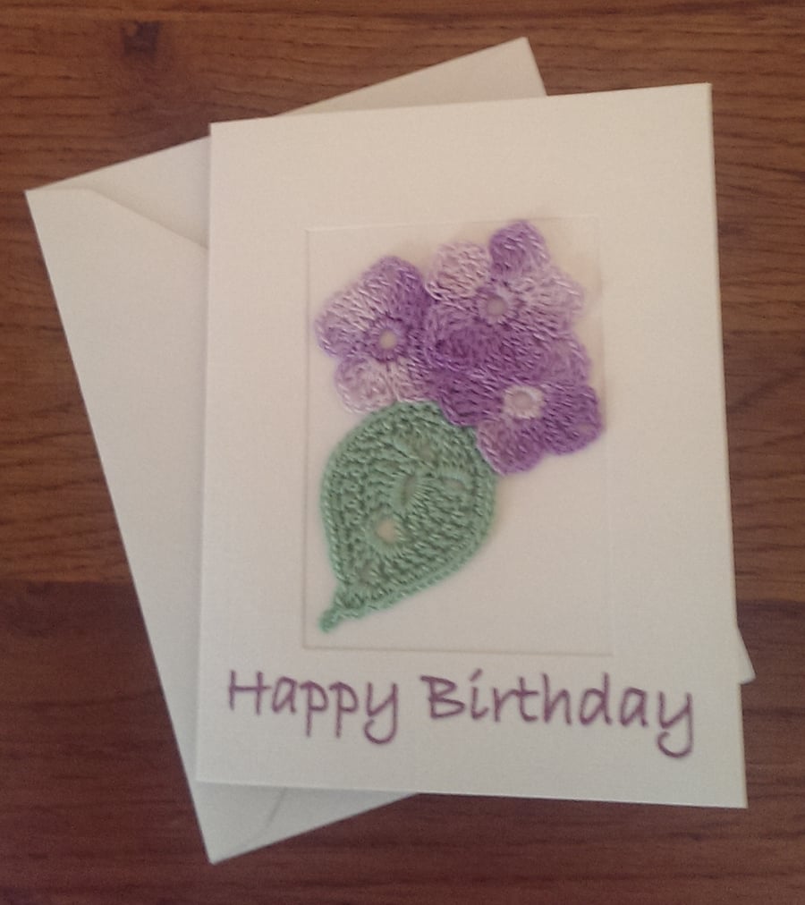 SMALL 'HAPPY BIRTHDAY' CARD WITH PRETTY LILAC FLOWER ON WHITE LINEN EFFECT CARD