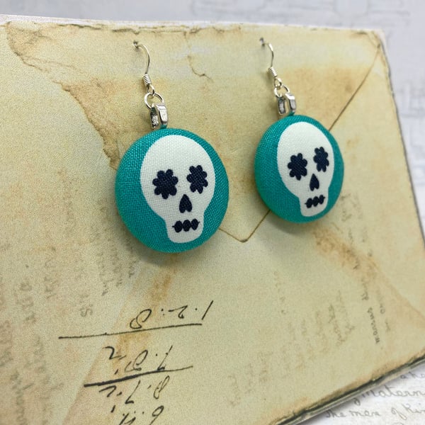 Skulls on aqua fabric button statement earrings Halloween inspired