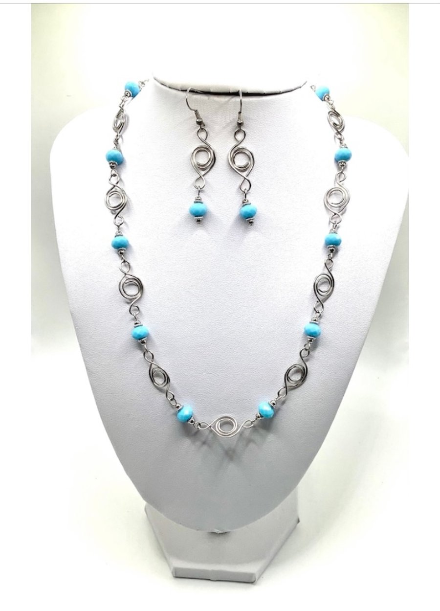 Silver plated wire work necklace and earring set.