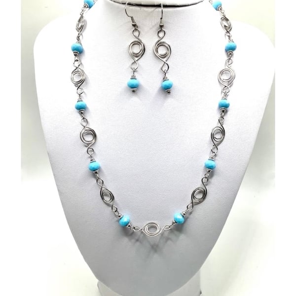 Silver plated wire work necklace and earring set.