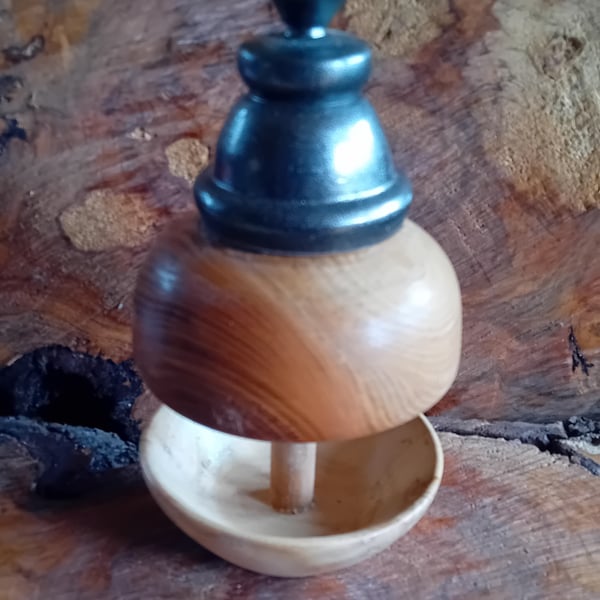 Hand turned bird feeder with black top. 