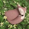 Snoozy fox.  A fox doorstop, made from a tactile herringbone wool.