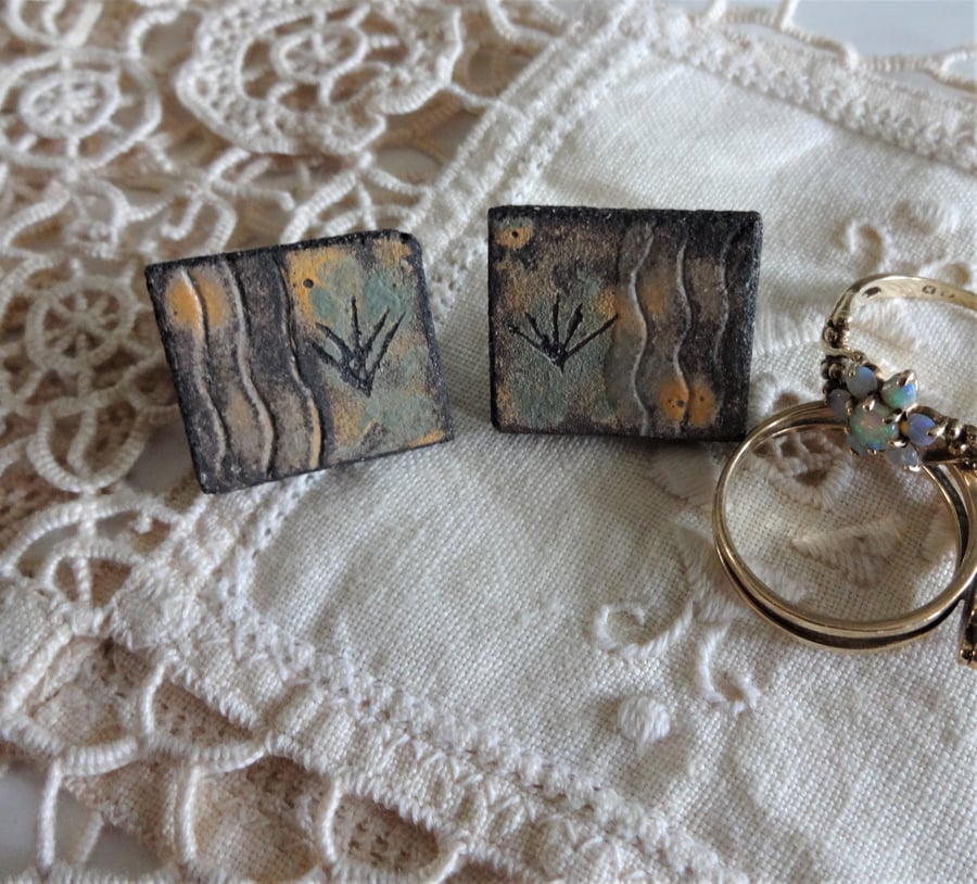 Ceramic earrings with sterling silver fittings.  Grasses motif.
