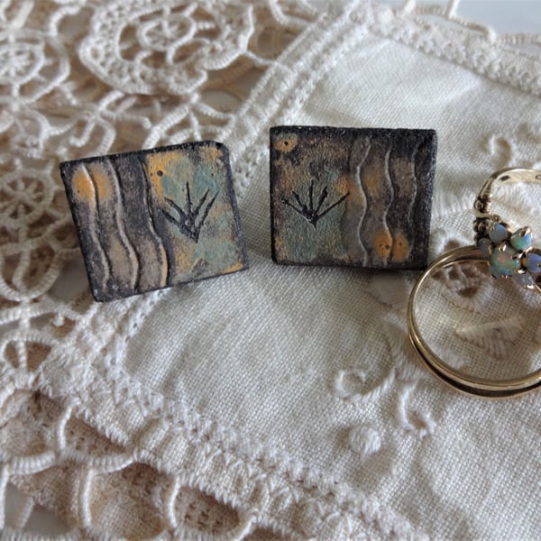 Ceramic earrings with sterling silver fittings.  Grasses motif.