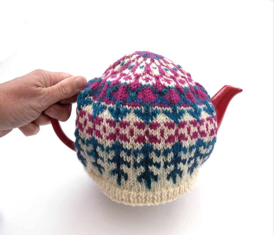 Colourful knitted tea cosy