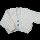 Hand knitted baby cardigan in cream with textured pattern 