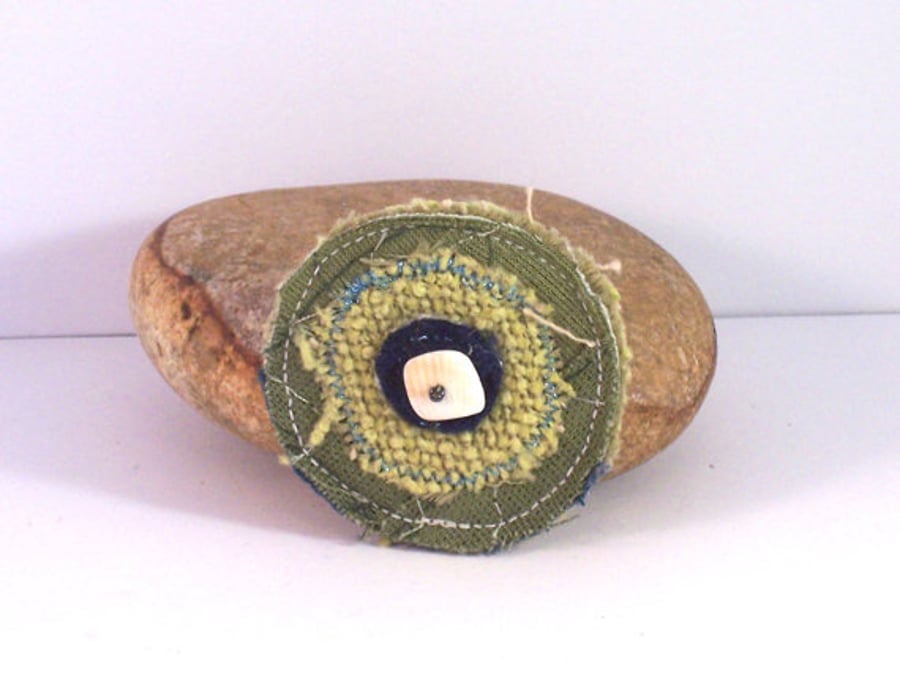 Pluto - textile brooch in green and blue