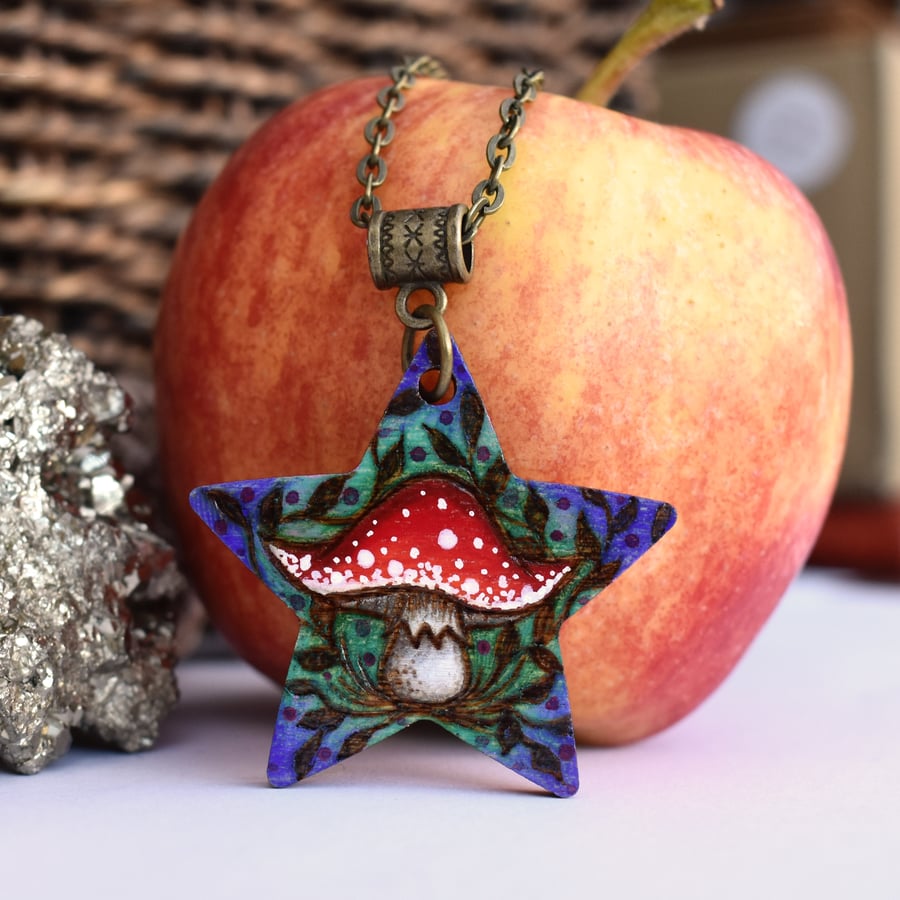 A shroom star. Pyrography toadstool pendant, fly agaric necklace.