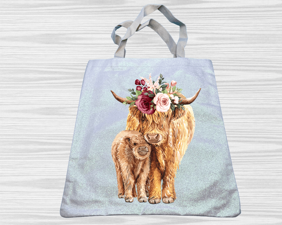Strikingly vibrant cow with calf tote bag