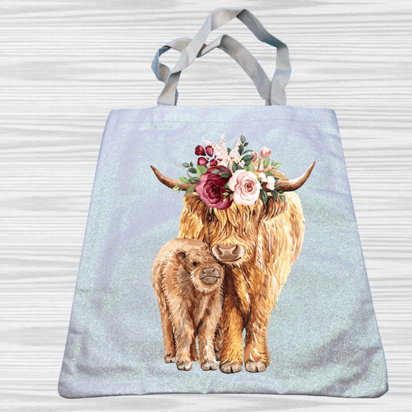 Strikingly vibrant cow with calf tote bag