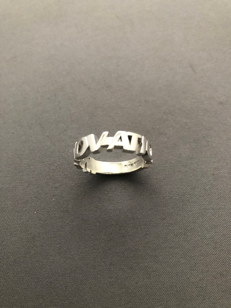 Solid silver innovation ring uppercase 