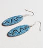 Oval Earrings with wavy line design - Image 6