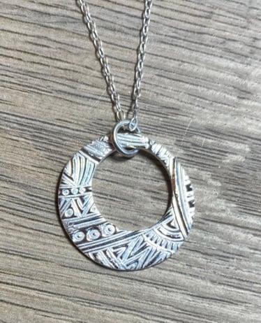 Pure silver circular necklace with cut out circle
