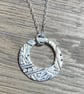 Pure silver circular necklace with cut out circle