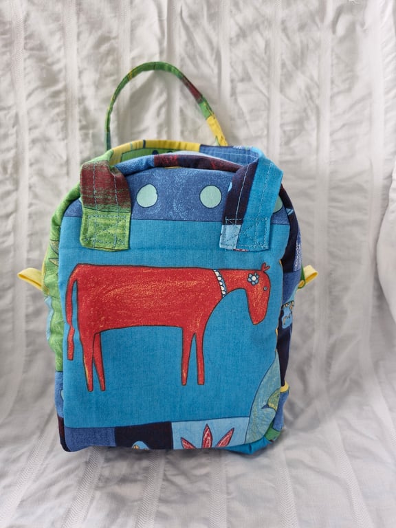 Child size zipped cool bag or lunch bag with insulated facing and animal print