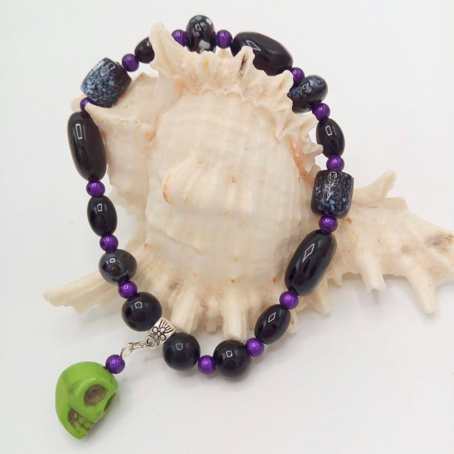 Black and Purple Beaded Stretch Bracelet with Green Skull, Bracelet, 