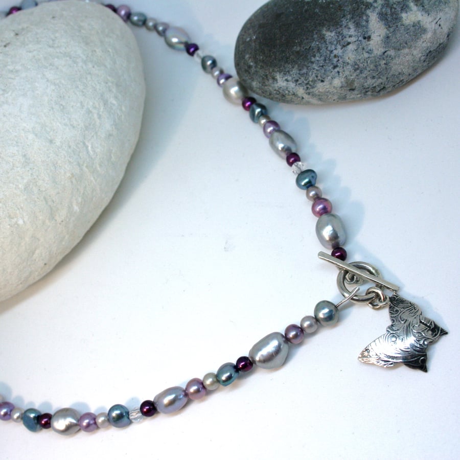 Purple, grey and turqoiuse pearl necklace with t-bar clasp and butterfly pendant