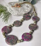Disc shaped necklace in dark green and magenta - Image 2