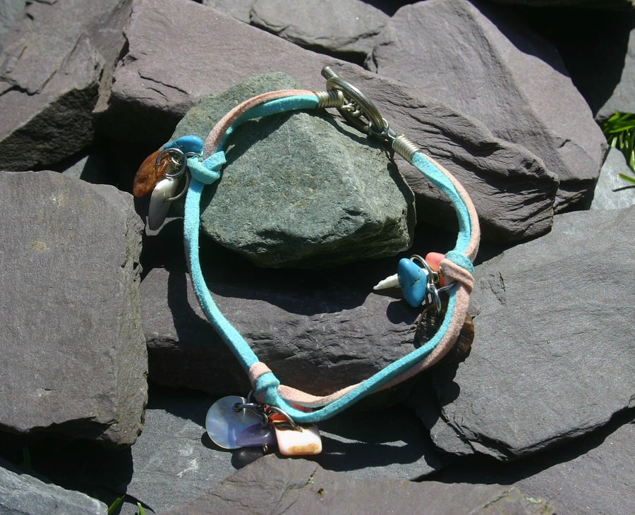 Light pink and turquoise suede anklet with toggle clasp and charms.
