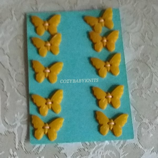 Mustard yellow butterfly plastic buttons